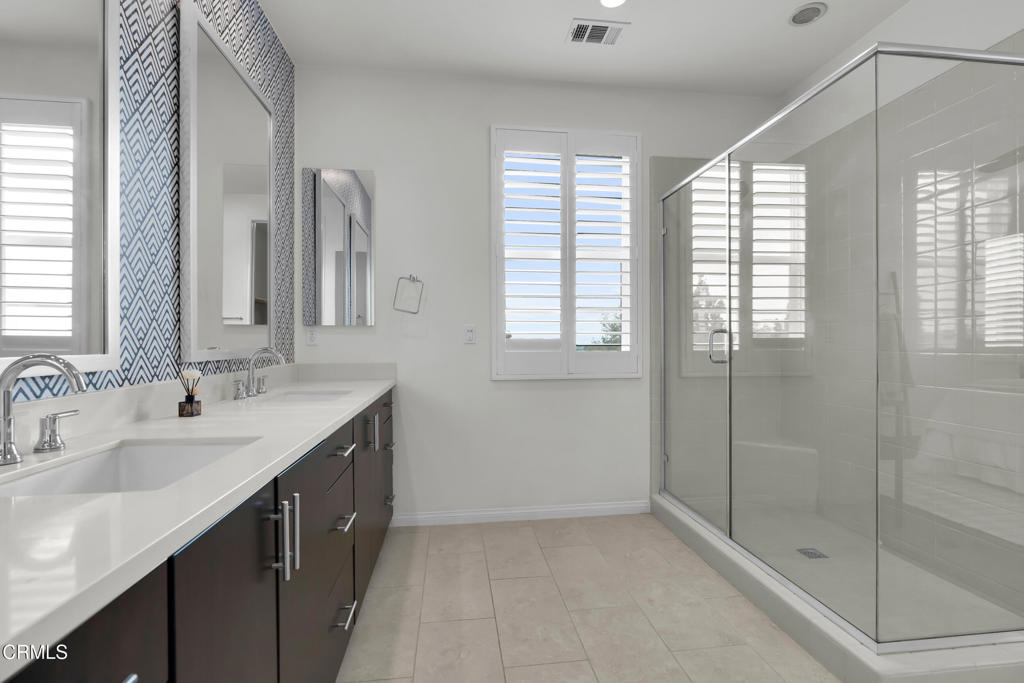 900 North Primrose Lane, Unit A Azusa, CA 91702 - Photo 24 of 55 a bathroom with double sink and two mirror
