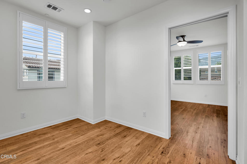 900 North Primrose Lane, Unit A Azusa, CA 91702 - Photo 35 of 55 an empty room with wooden floor and windows