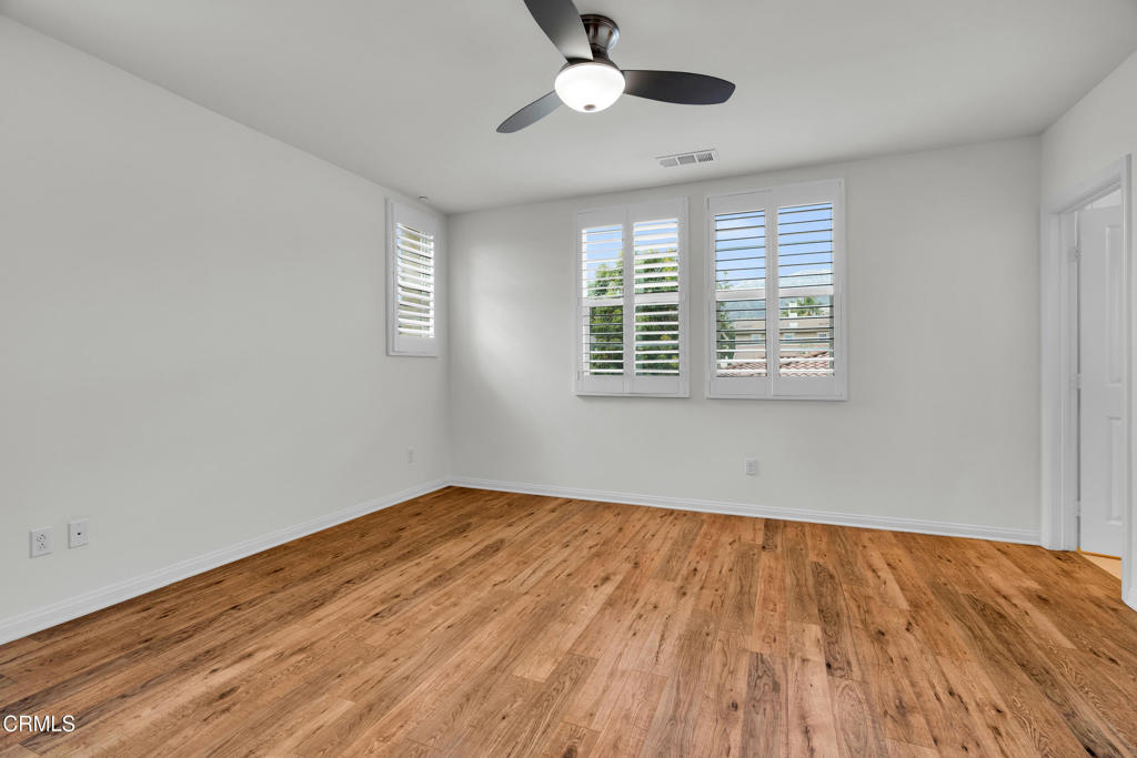 900 North Primrose Lane, Unit A Azusa, CA 91702 - Photo 36 of 55 a view of an empty room with wooden floor and a window
