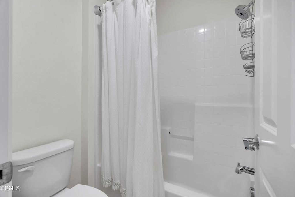 900 North Primrose Lane, Unit A Azusa, CA 91702 - Photo 39 of 55 a white toilet sitting next to a bath tub