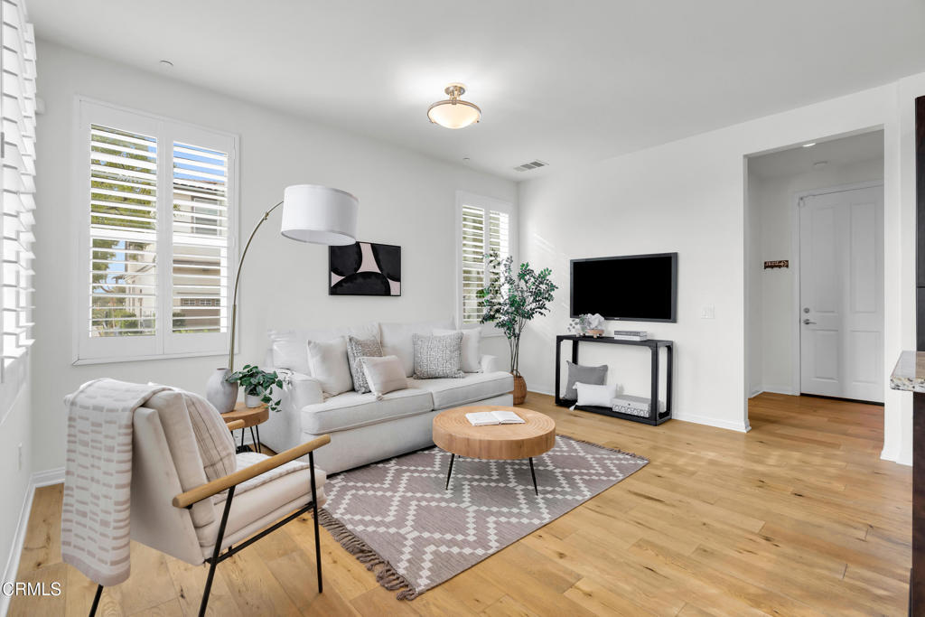 900 North Primrose Lane, Unit A Azusa, CA 91702 - Photo 5 of 55 a living room with furniture and a flat screen tv