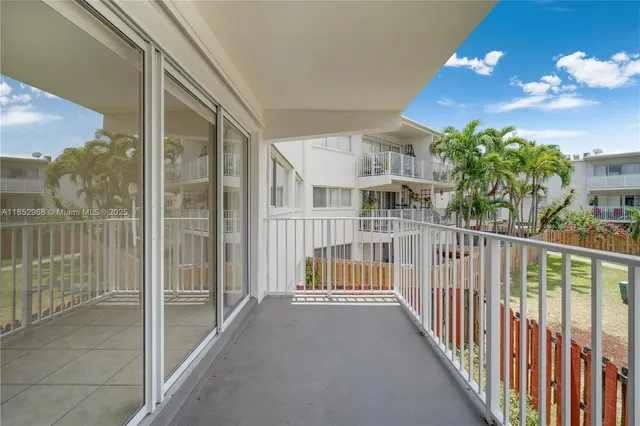 a swimming pool with outdoor seating and barbeque oven