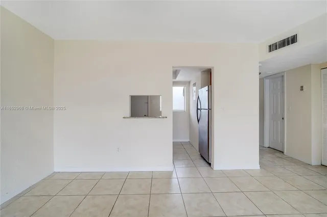 a kitchen with granite countertop a sink stove and cabinets