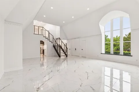 a view of an entryway with wooden floor