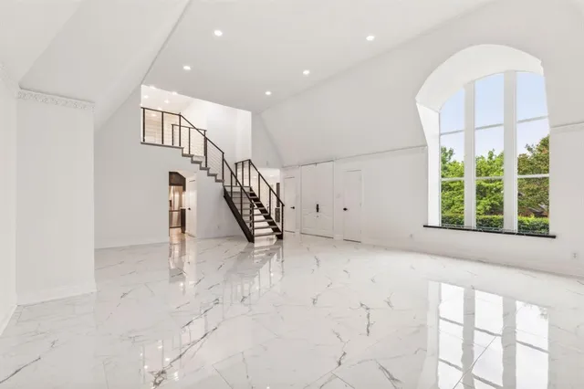 a view of an entryway with wooden floor
