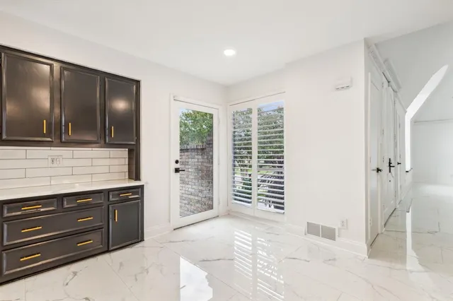 a view of room with window and bathroom