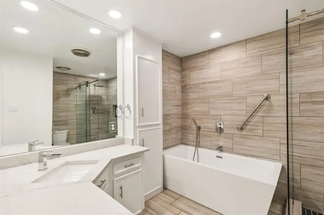 a bathroom with a bathtub sink and toilet