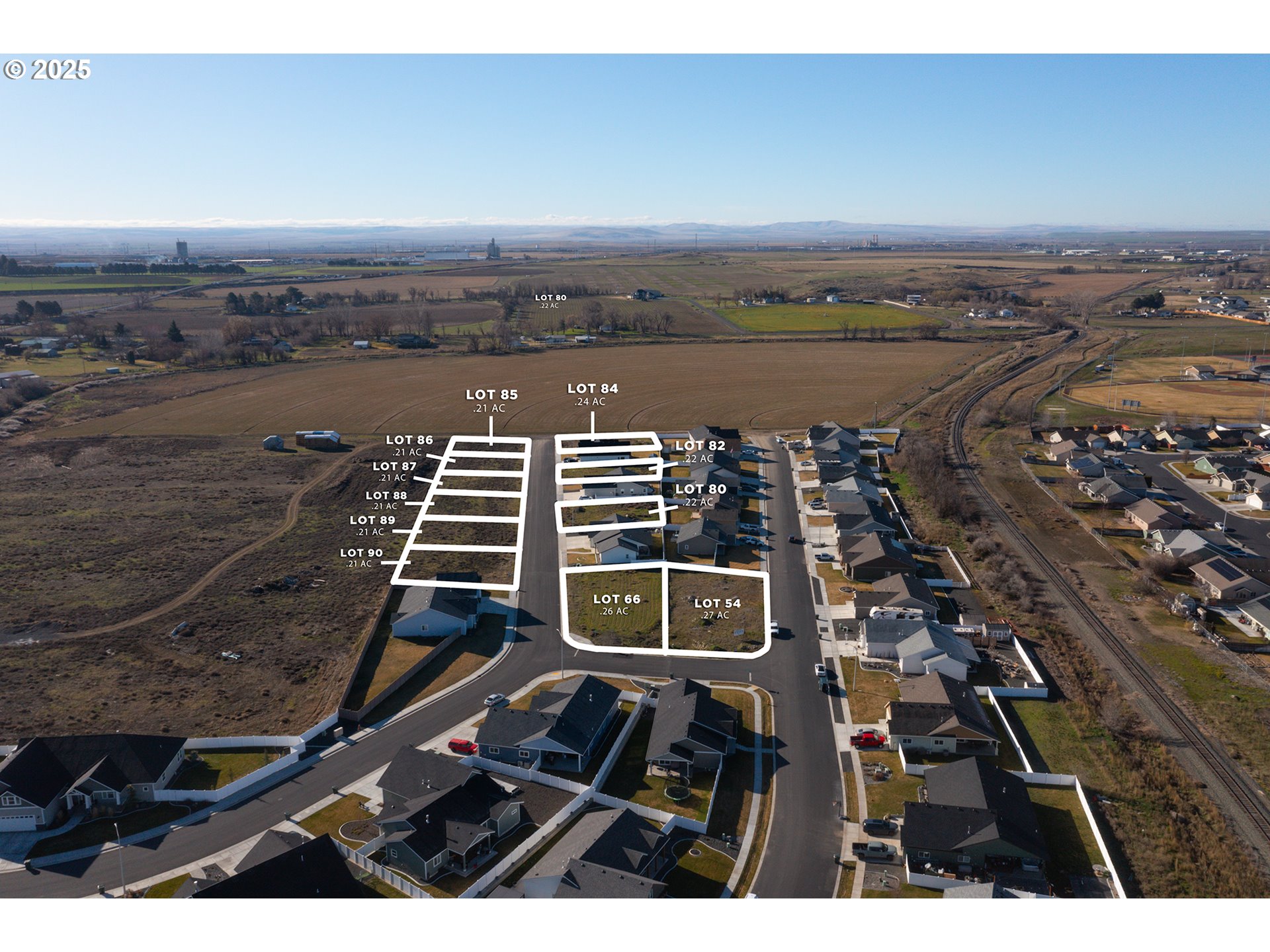 583 Southwest Desert Sky Drive, Unit 87 Hermiston, OR 97838 - Photo 5 of 8 an aerial view of a city