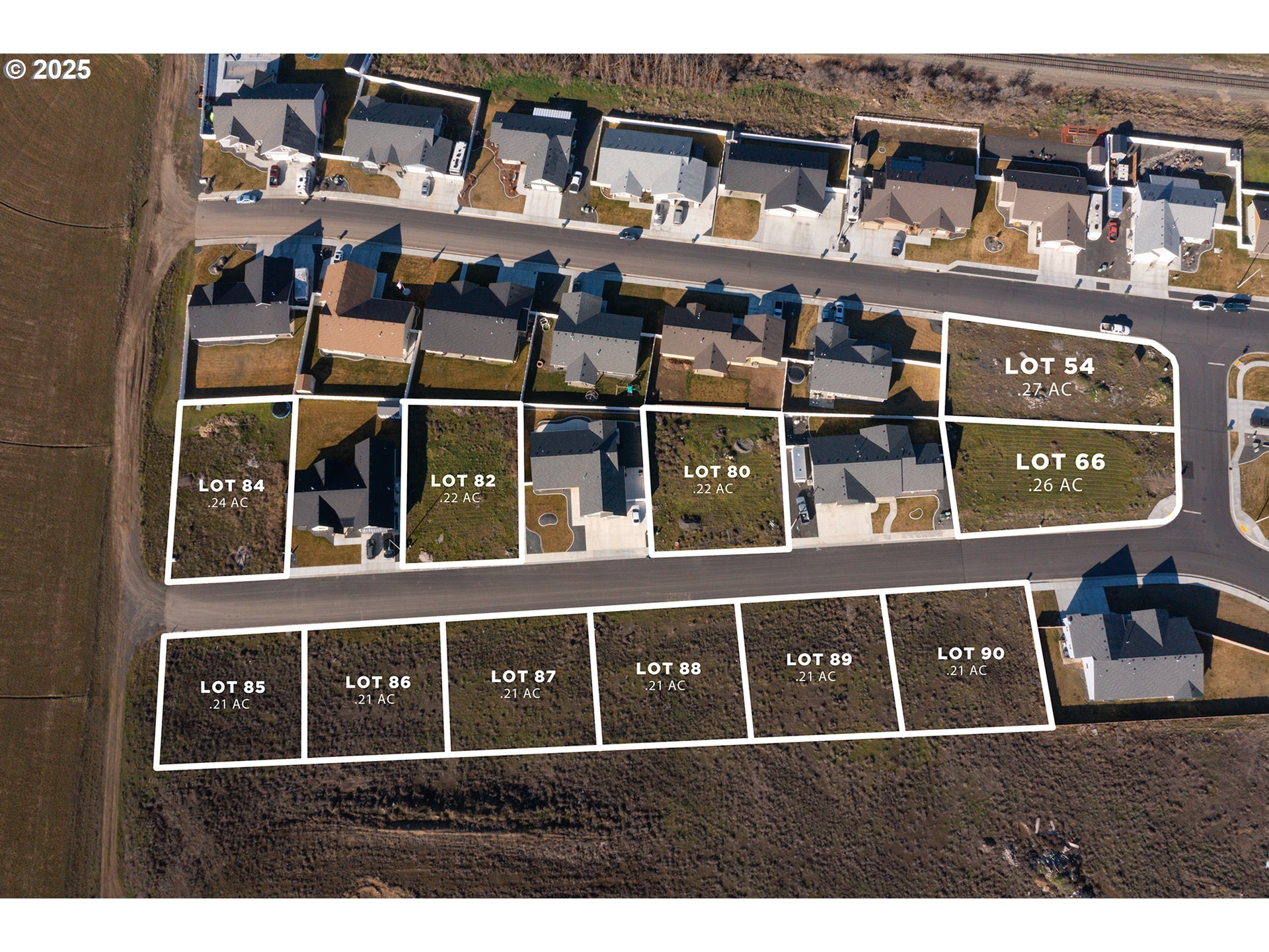 583 Southwest Desert Sky Drive, Unit 87 Hermiston, OR 97838 - Photo 6 of 8 a black and white building with windows