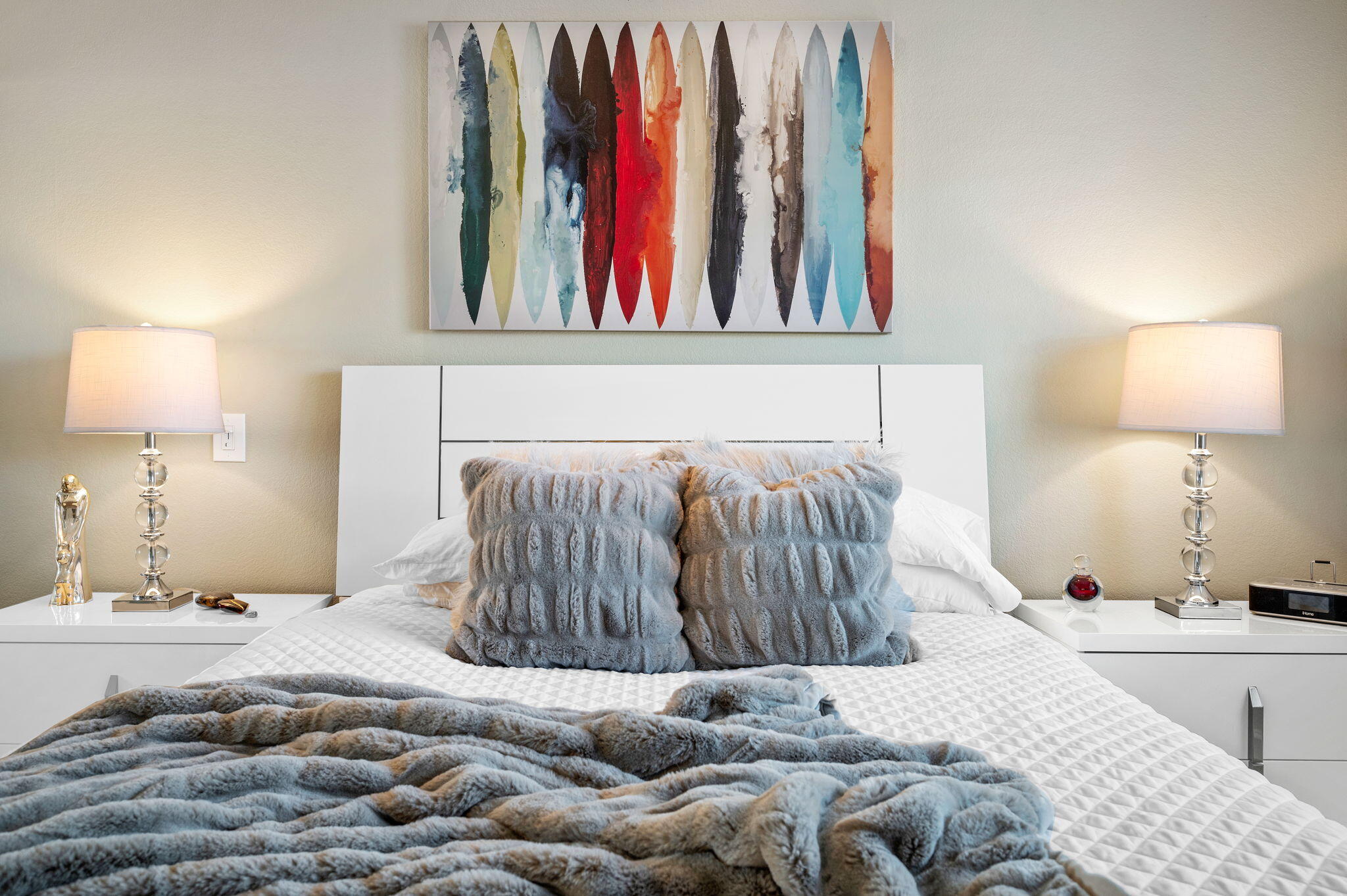 47800 Madison Street, Unit 100 Indio, CA 92201 - Photo 16 of 28 a bedroom with a bed and a painting on the wall