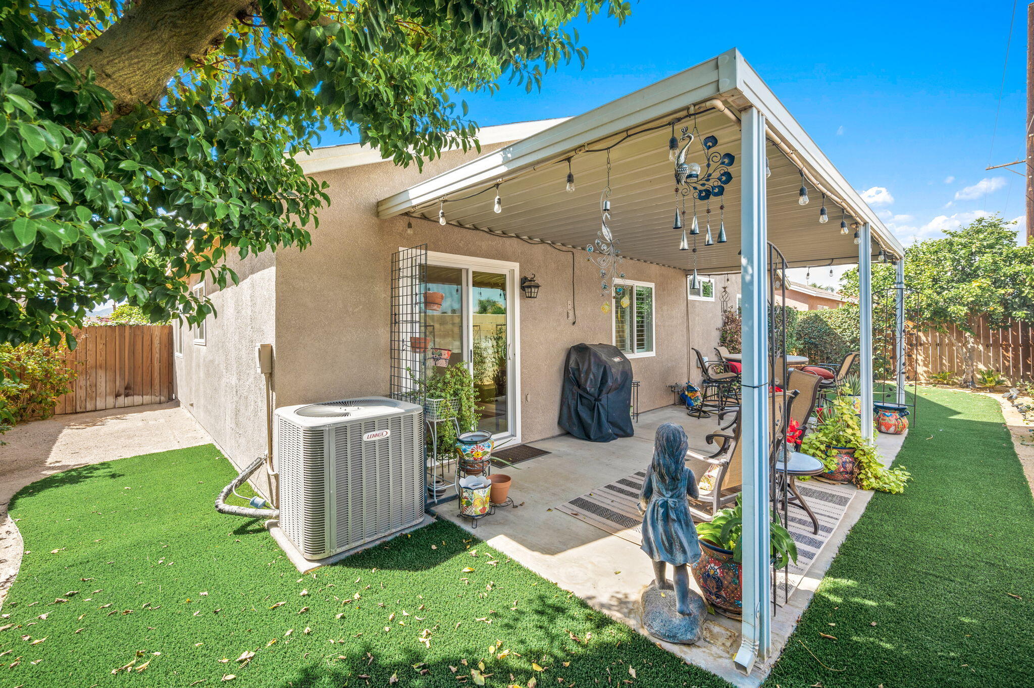 47800 Madison Street, Unit 100 Indio, CA 92201 - Photo 22 of 28 a view of a house with backyard and porch