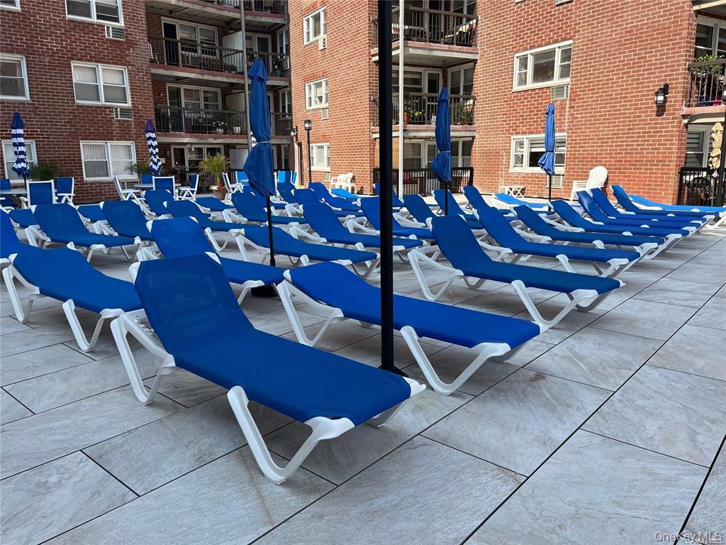 750 Shore Road, Unit 4N Long Beach, NY 11561 - Photo 9 of 14 a view of a chairs and tables in the patio