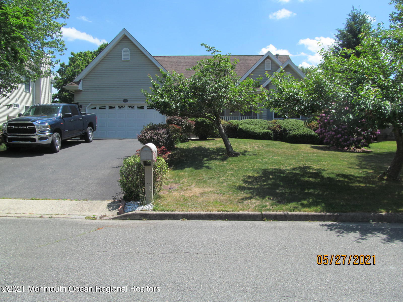 133 Compass Road Manahawkin, NJ 08050 - Photo 1 of 27 a view of a yard and front view of a house