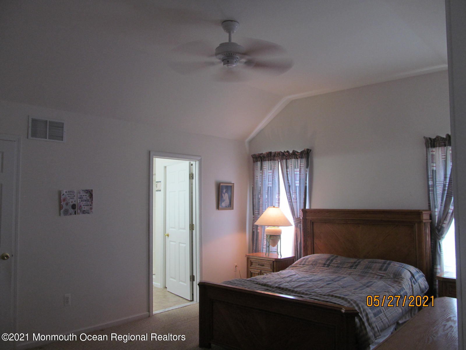 133 Compass Road Manahawkin, NJ 08050 - Photo 13 of 27 a bedroom with a bed and a chandelier