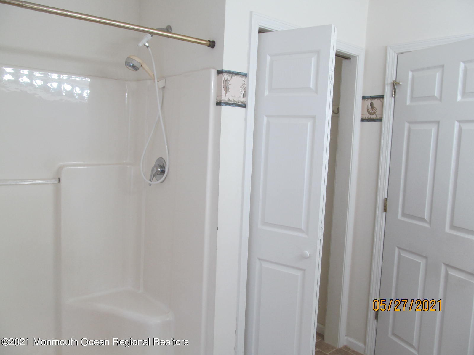 133 Compass Road Manahawkin, NJ 08050 - Photo 16 of 27 a bathroom with a glass shower door