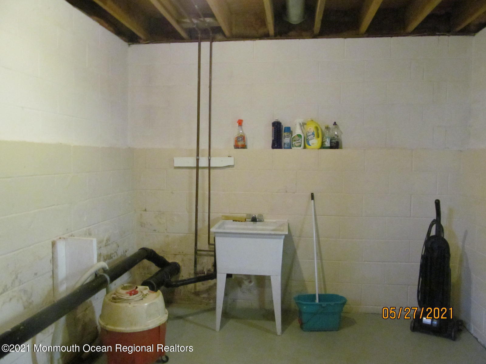 133 Compass Road Manahawkin, NJ 08050 - Photo 25 of 27 a bathroom with a sink and a mirror