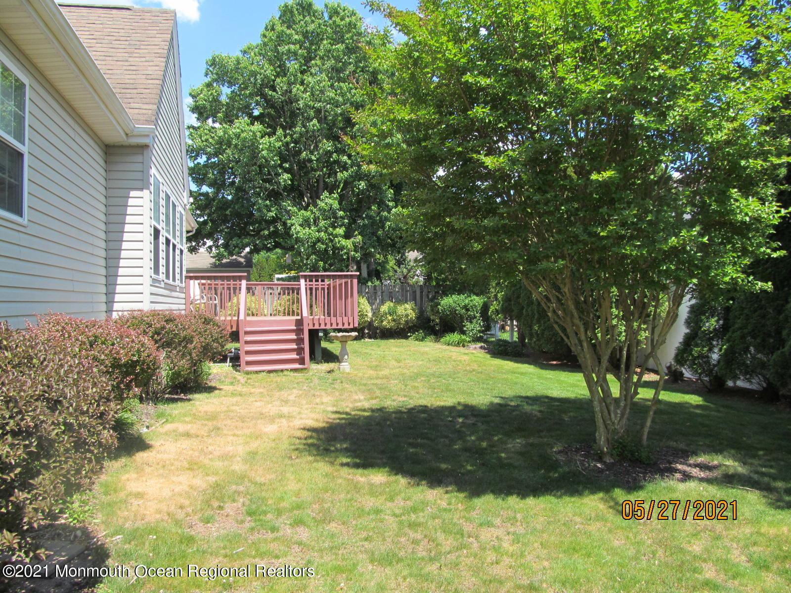 133 Compass Road Manahawkin, NJ 08050 - Photo 4 of 27 a backyard of a house with yard and trampoline