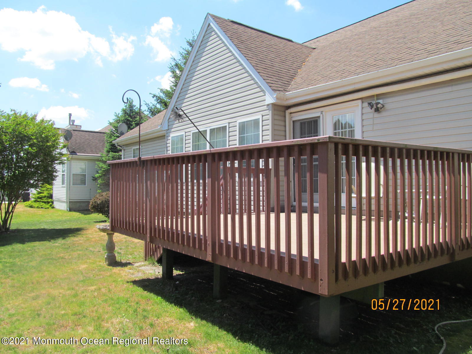 133 Compass Road Manahawkin, NJ 08050 - Photo 6 of 27 a view of a backyard with a garden