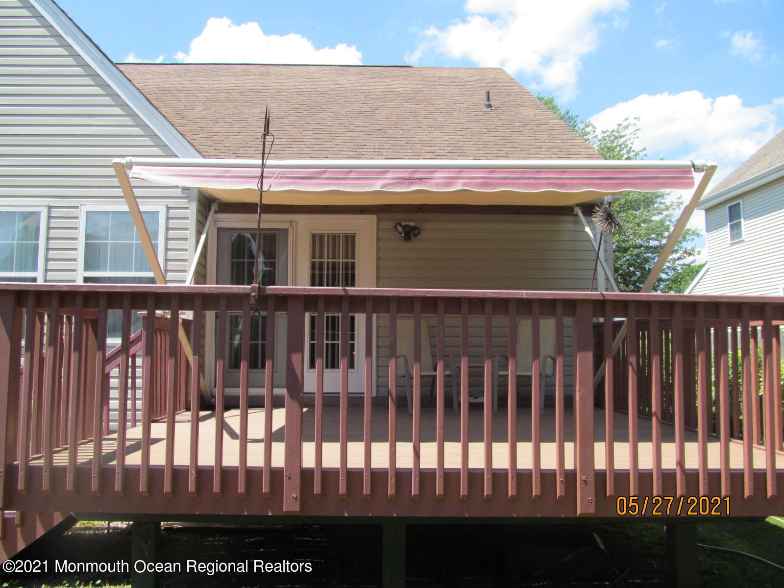 133 Compass Road Manahawkin, NJ 08050 - Photo 7 of 27 a view of a white house with many windows