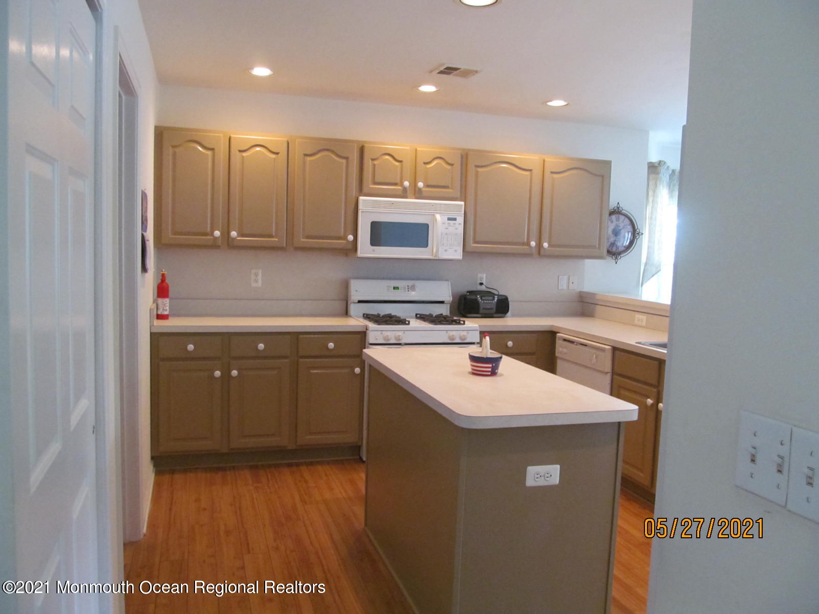133 Compass Road Manahawkin, NJ 08050 - Photo 8 of 27 a kitchen with a sink stove and cabinets
