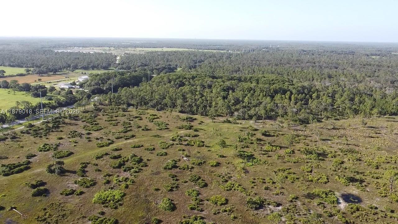 0 Del Verde Punta Gorda, FL 33982 - Photo 6 of 8 an aerial view of house with yard and mountain view in back