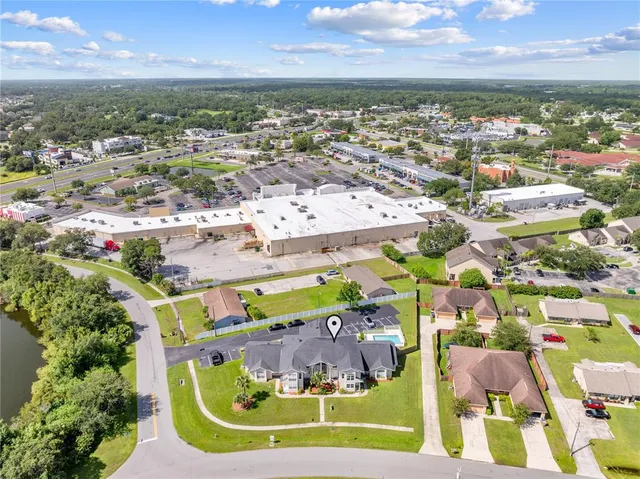 an aerial view of residential houses with outdoor space