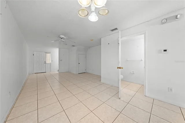 a kitchen with a stove sink and cabinets