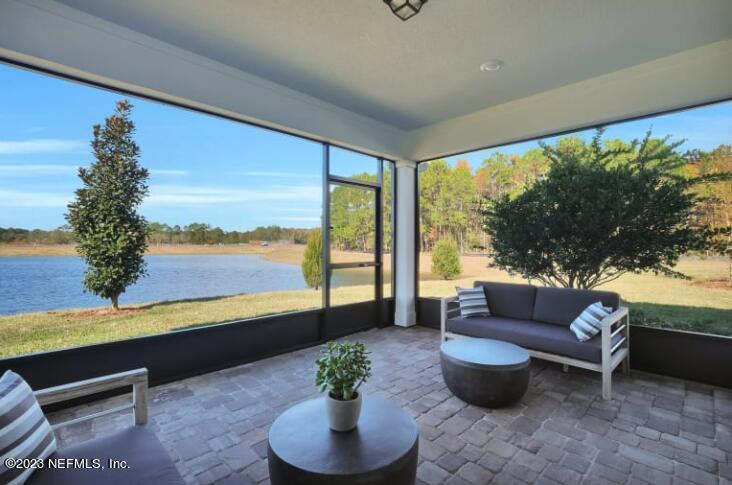 677 Blind Oak Cir Street St. Augustine, FL 32095 - Photo 15 of 19 a living room with furniture and a large window