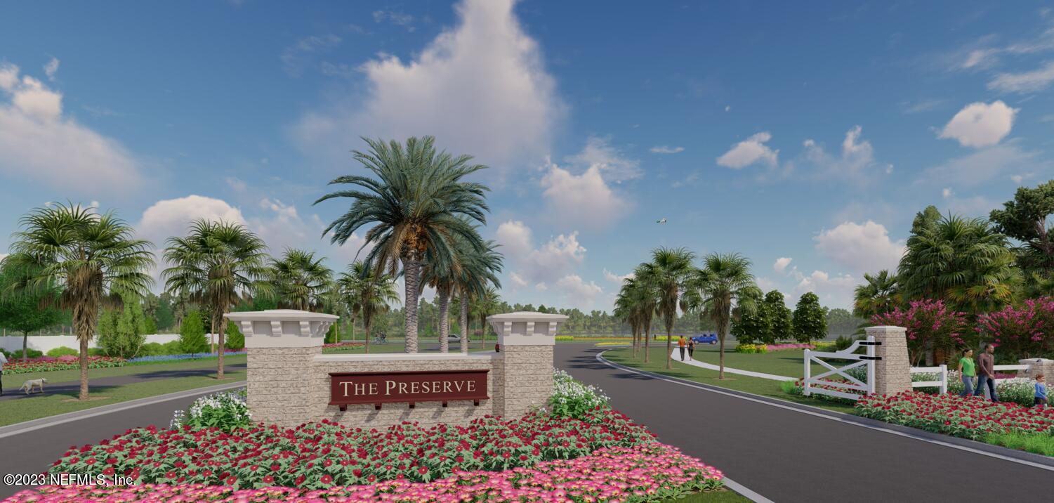 677 Blind Oak Cir Street St. Augustine, FL 32095 - Photo 4 of 19 a view of a street with a bench and trees around