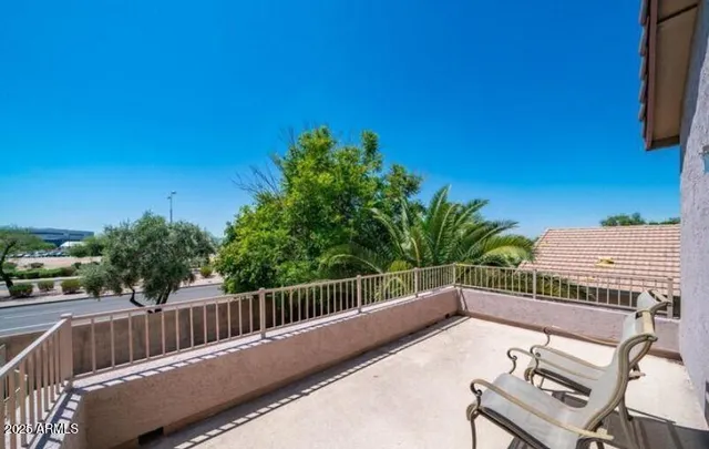 a view of a balcony with furniture