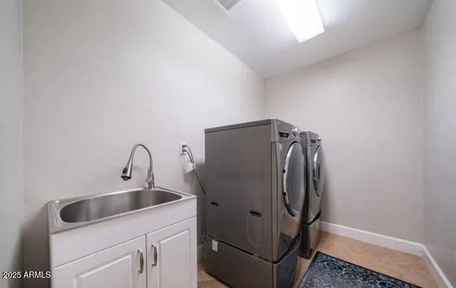 a bathroom with a sink and mirror