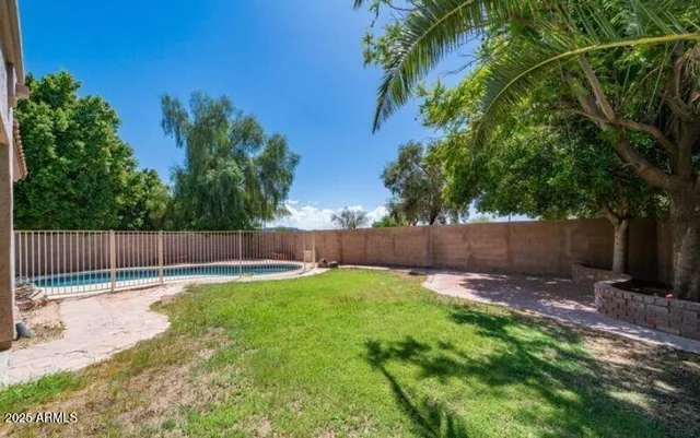 a swimming pool with wooden fence