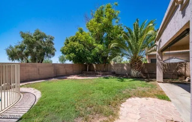 a backyard of a house with lots of green space