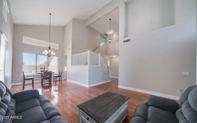 a living room with furniture and a table