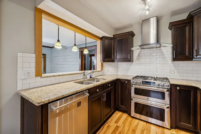 a kitchen with a sink stove and microwave