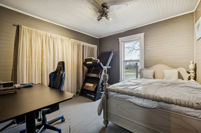 a view of staircase with wooden floor and white walls