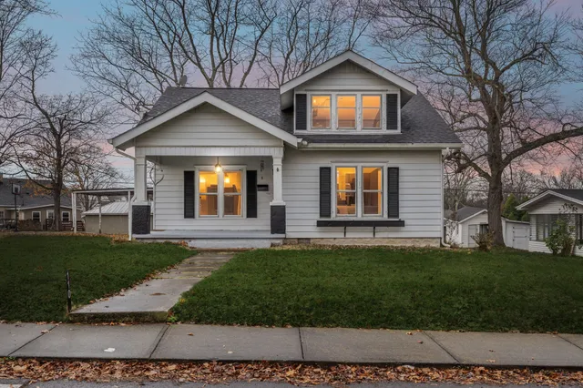a front view of a house with a yard