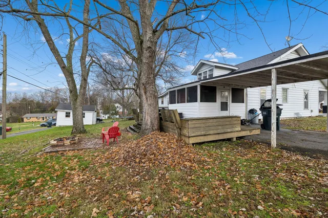 a view of a house with a wooden fence