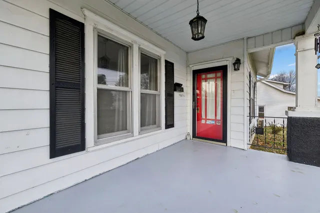 a view of an empty room with a ceiling fan