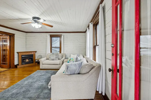 a living room with furniture and a fireplace