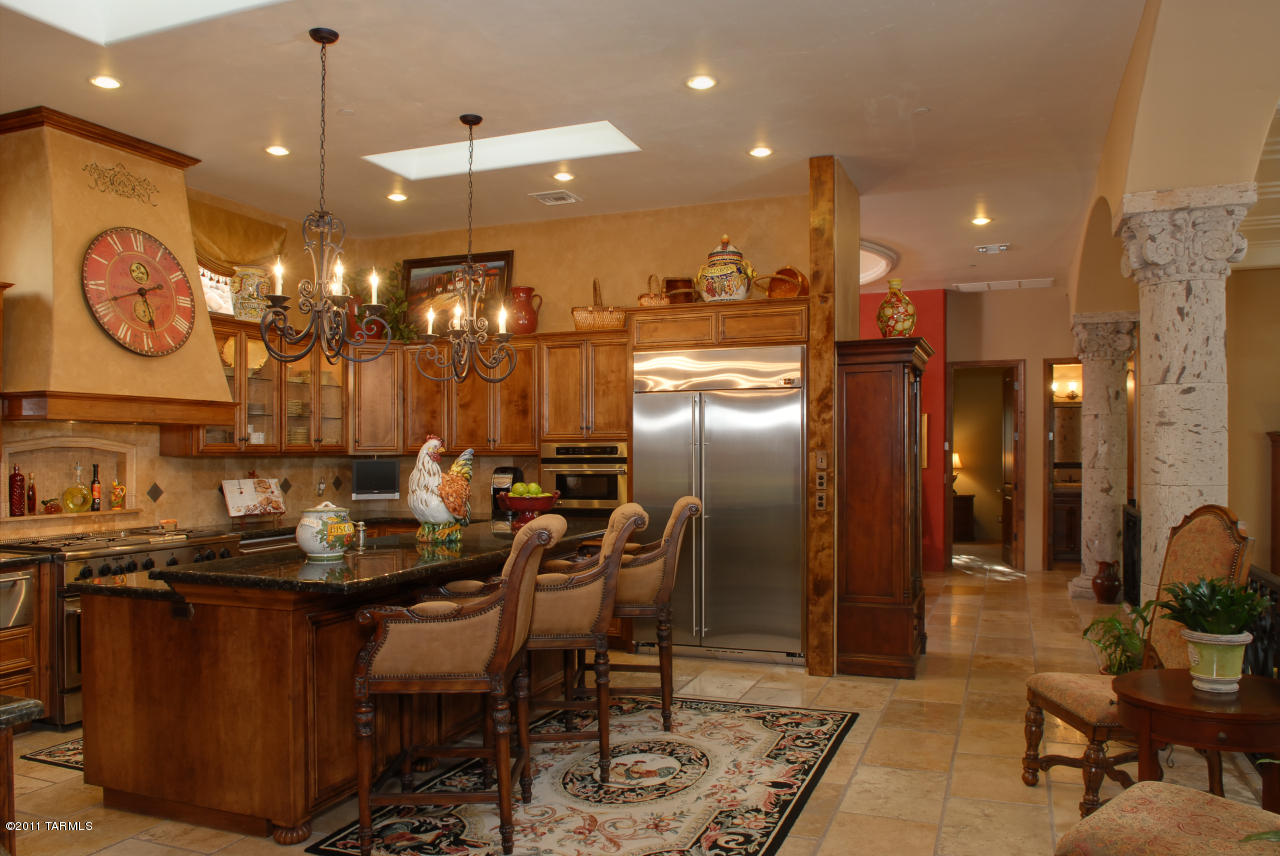 2188 East Buck Ridge Place Oro Valley, AZ 85737 - Photo 6 of 22 a dining table chairs and a dining table with wooden floor