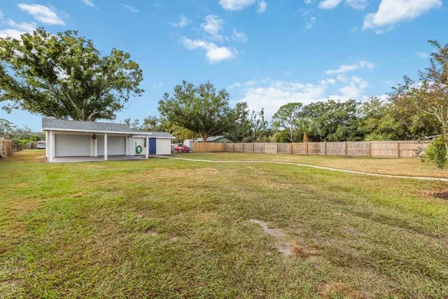 a view of a swimming pool with a bench in dining room