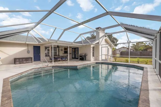 a view of a swimming pool with a bench in it