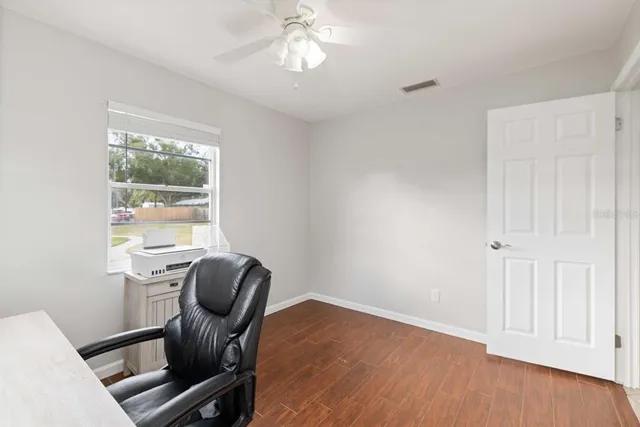 a bathroom with a sink a toilet a mirror and shower