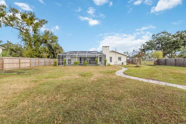 a view of a house with a big yard