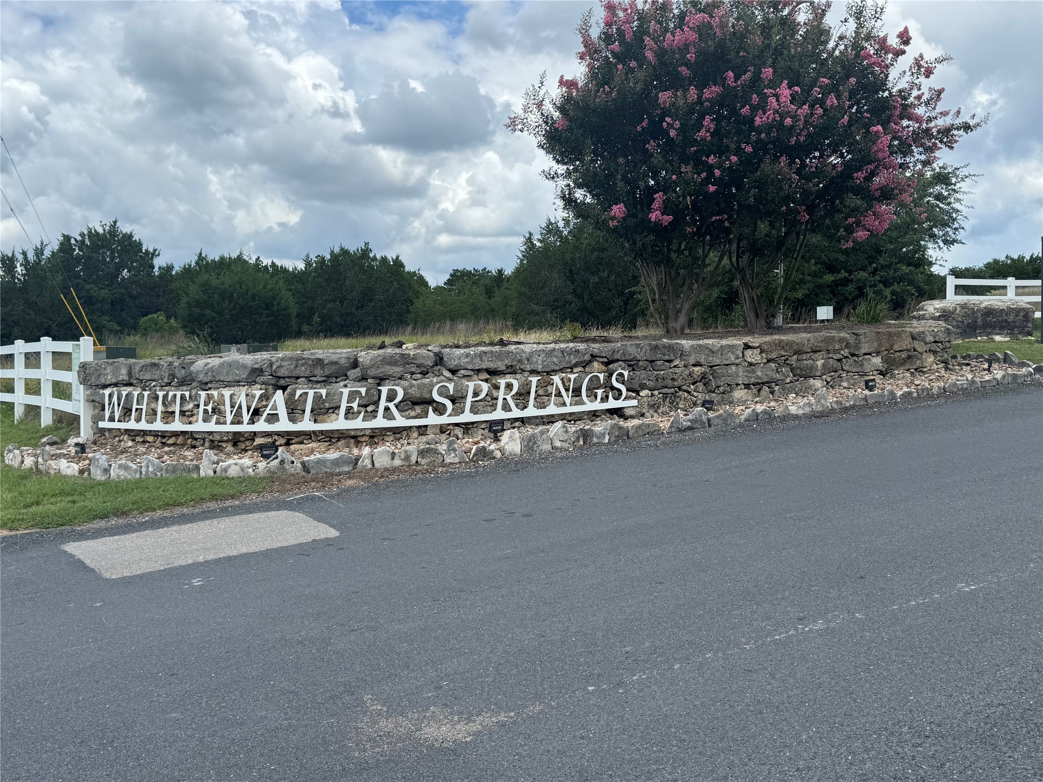 155 Balcones Ridge Way Bertram, TX 78605 - Photo 37 of 37 A welcoming stone entry with elegant signage defines the community's refined presence.