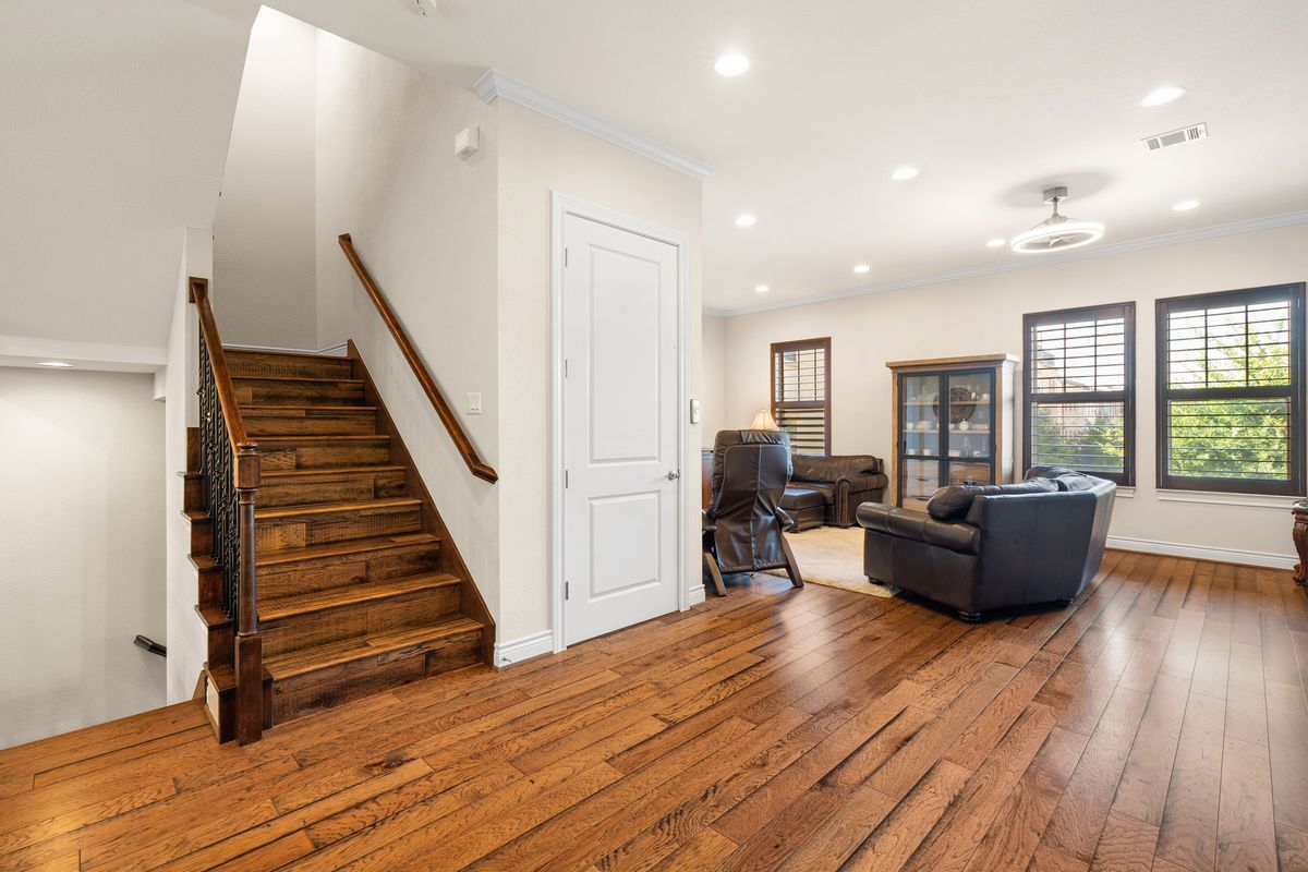 1116 Highknoll Lane Georgetown, TX 78628 - Photo 12 of 36 a living room with furniture and a wooden floor