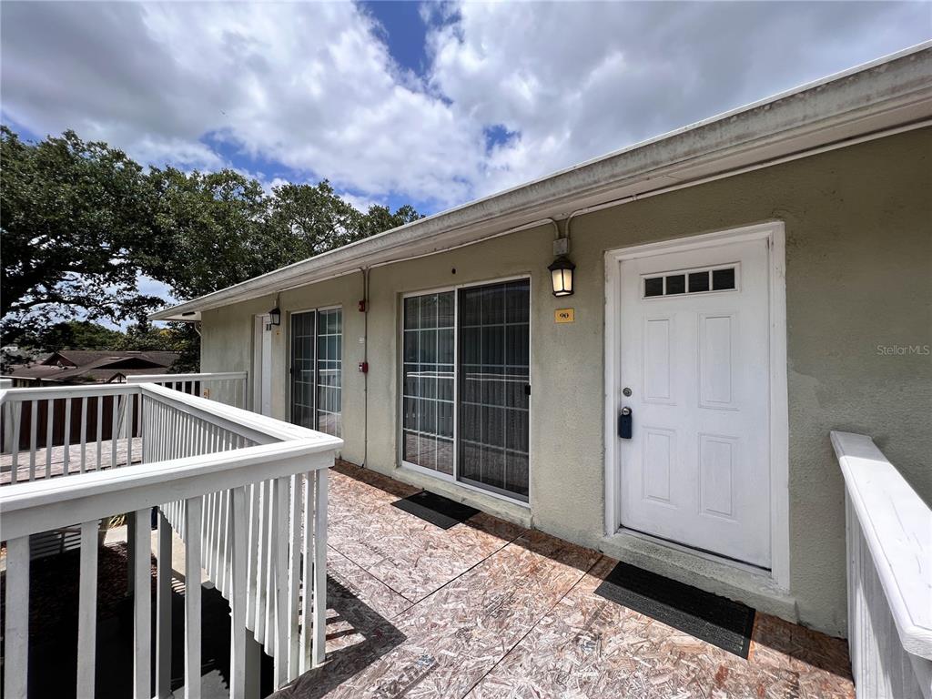4878 South Conway Road, Unit 90 Orlando, FL 32812 - Photo 1 of 1 a view of house with wooden floor and a yard