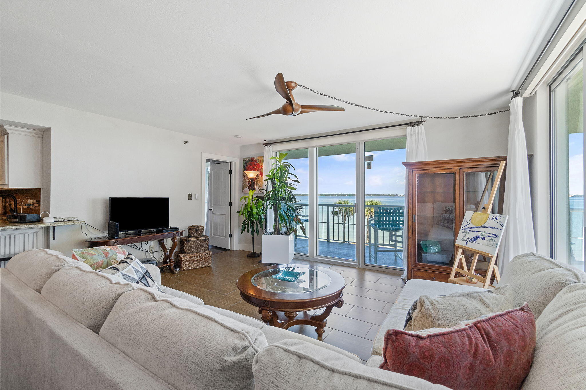 1200 Fort Pickens Road, Unit 1E Pensacola Beach, FL 32561 - Photo 12 of 44 a living room with furniture and a large window