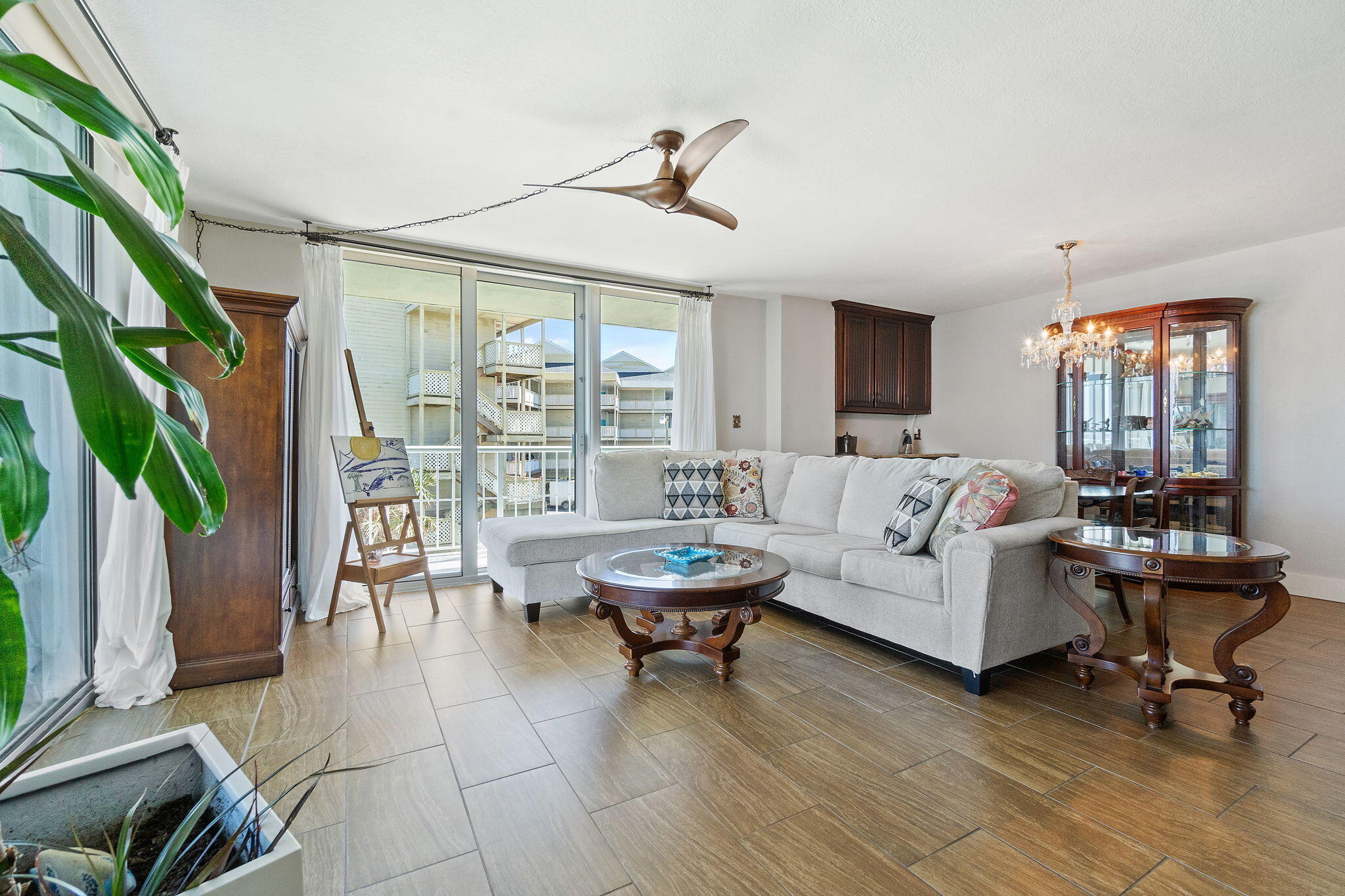 1200 Fort Pickens Road, Unit 1E Pensacola Beach, FL 32561 - Photo 13 of 44 a living room with furniture and a potted plant